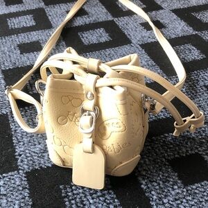Cream Embossed Drawstring Mini Bucket Crossbody Bag